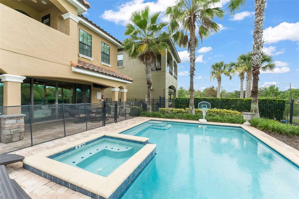 717 Desert Mountain Court Reunion, FL 34747 - Photo 56 of 62 a view of a house with pool and a yard