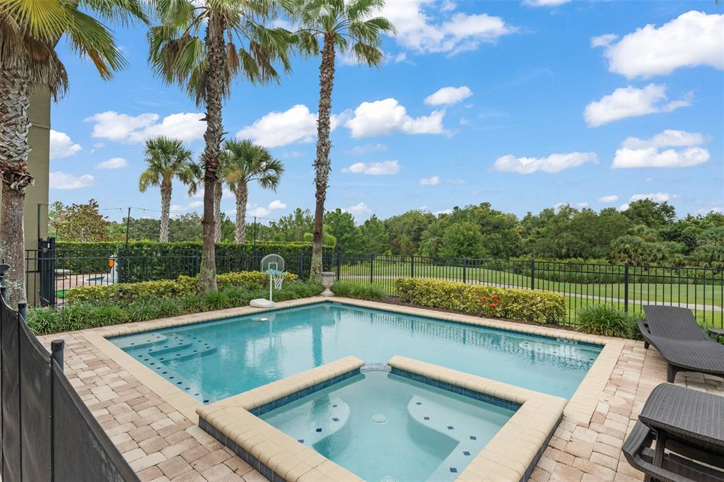 717 Desert Mountain Court Reunion, FL 34747 - Photo 59 of 62 a view of a swimming pool with a patio