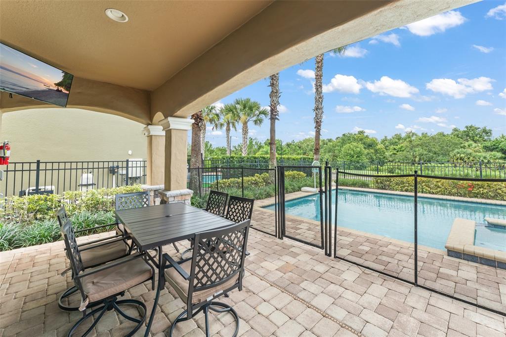 717 Desert Mountain Court Reunion, FL 34747 - Photo 60 of 62 a view of an outdoor dining space with furniture