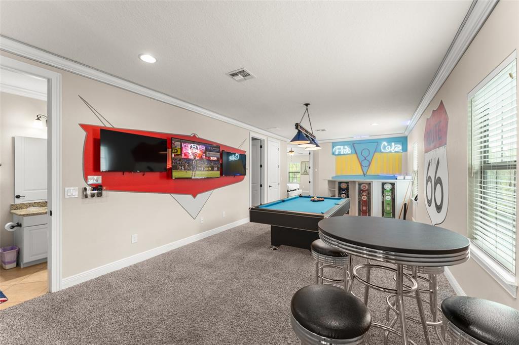 717 Desert Mountain Court Reunion, FL 34747 - Photo 9 of 62 a living room with furniture and a flat screen tv