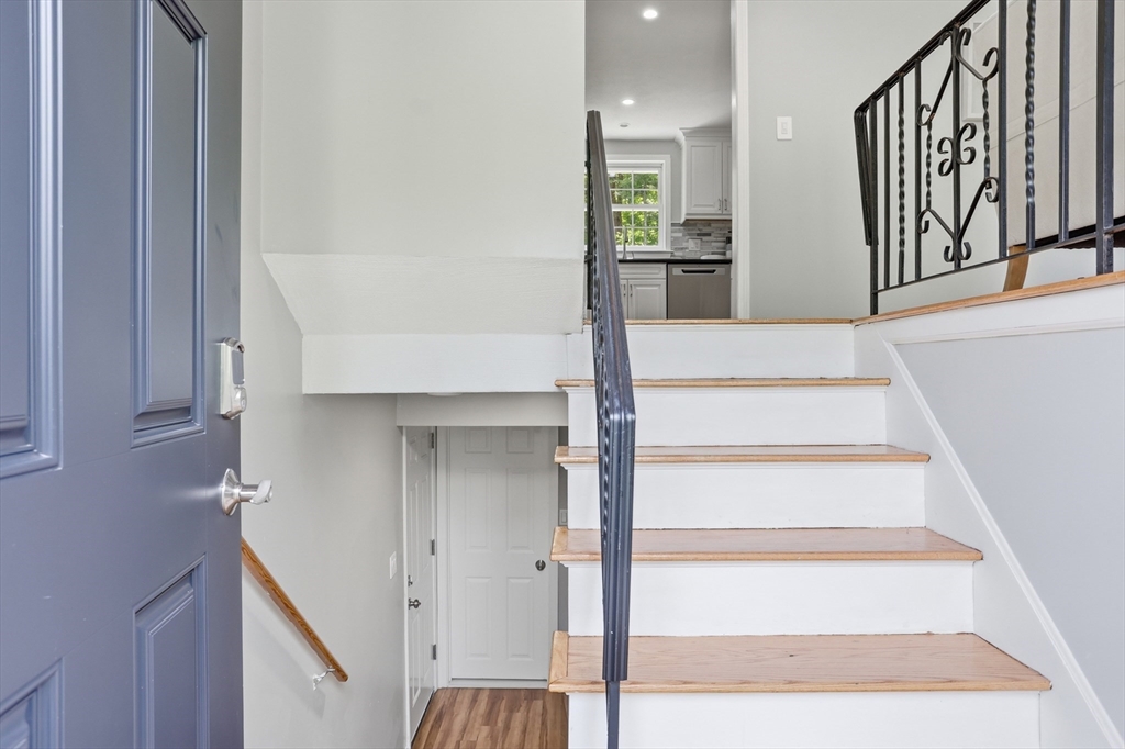 33 Simon Willard Road Acton, MA 01720 - Photo 3 of 42 a view of staircase with white walls and a window