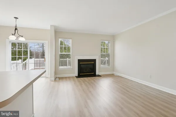 a view of wooden floor and a fireplace in a room