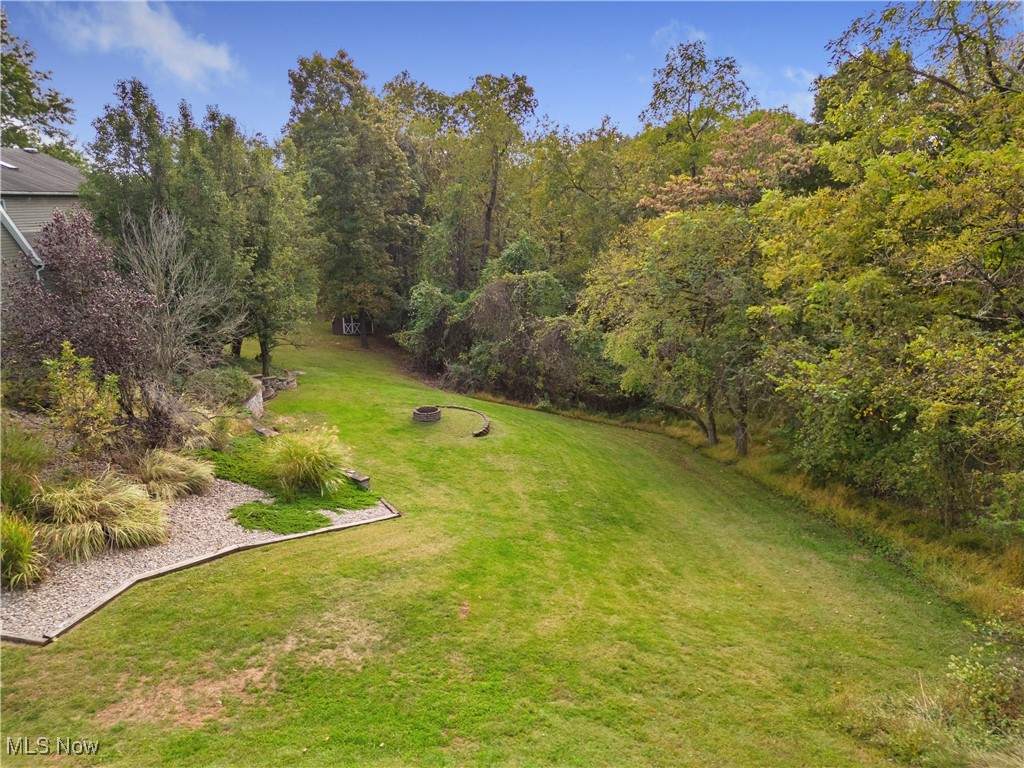 155 Ridgewood Boulevard Belpre, OH 45714 - Photo 11 of 49 View of grassy yard with a fire pit