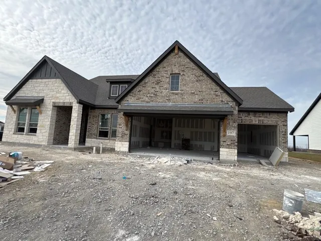 a view of a house with backyard porch and sitting area