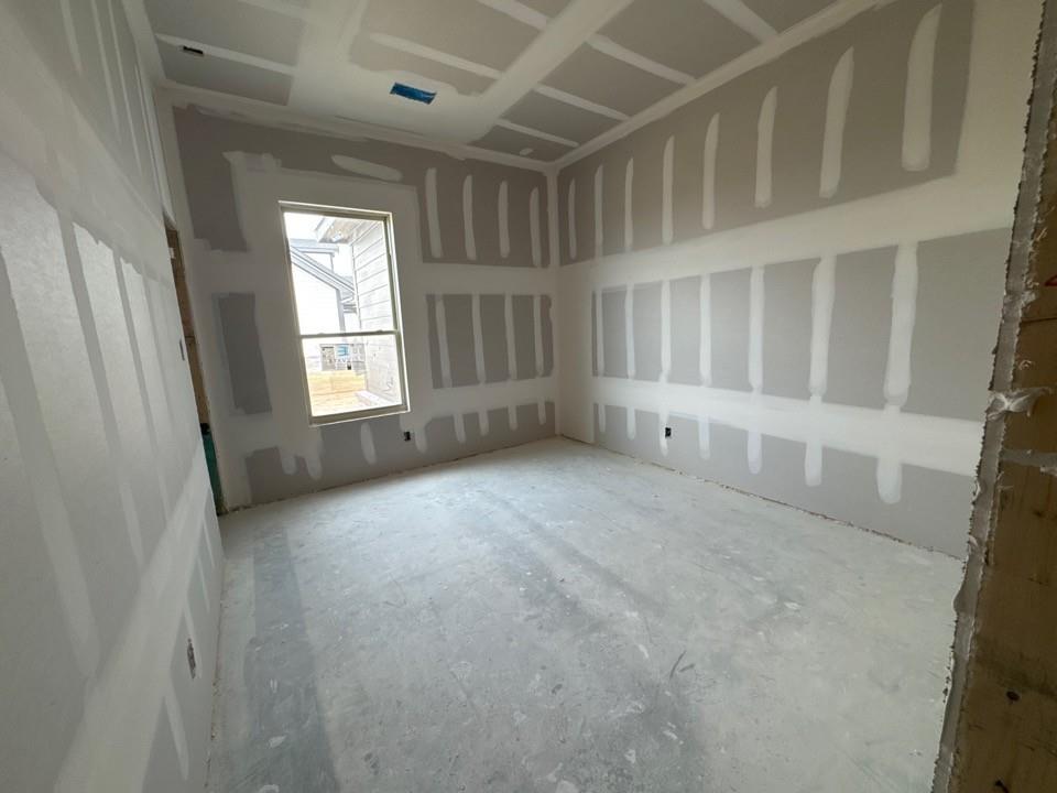 197 Brandywine Trail Rhome, TX 76078 - Photo 11 of 14 a view of an empty room with a window
