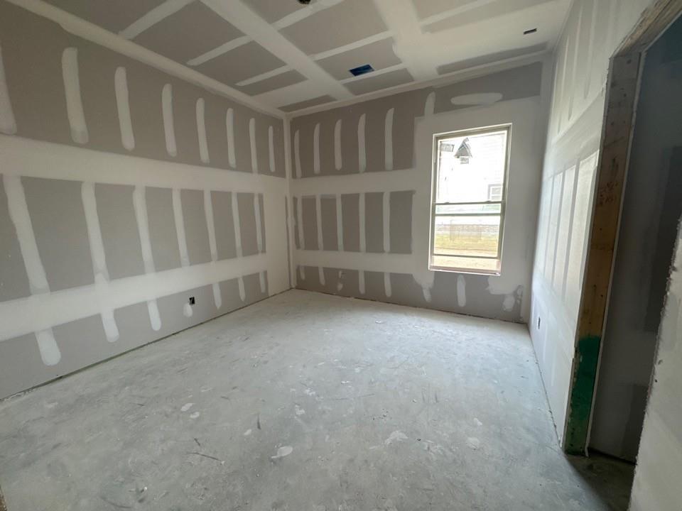 197 Brandywine Trail Rhome, TX 76078 - Photo 13 of 14 an empty room with windows
