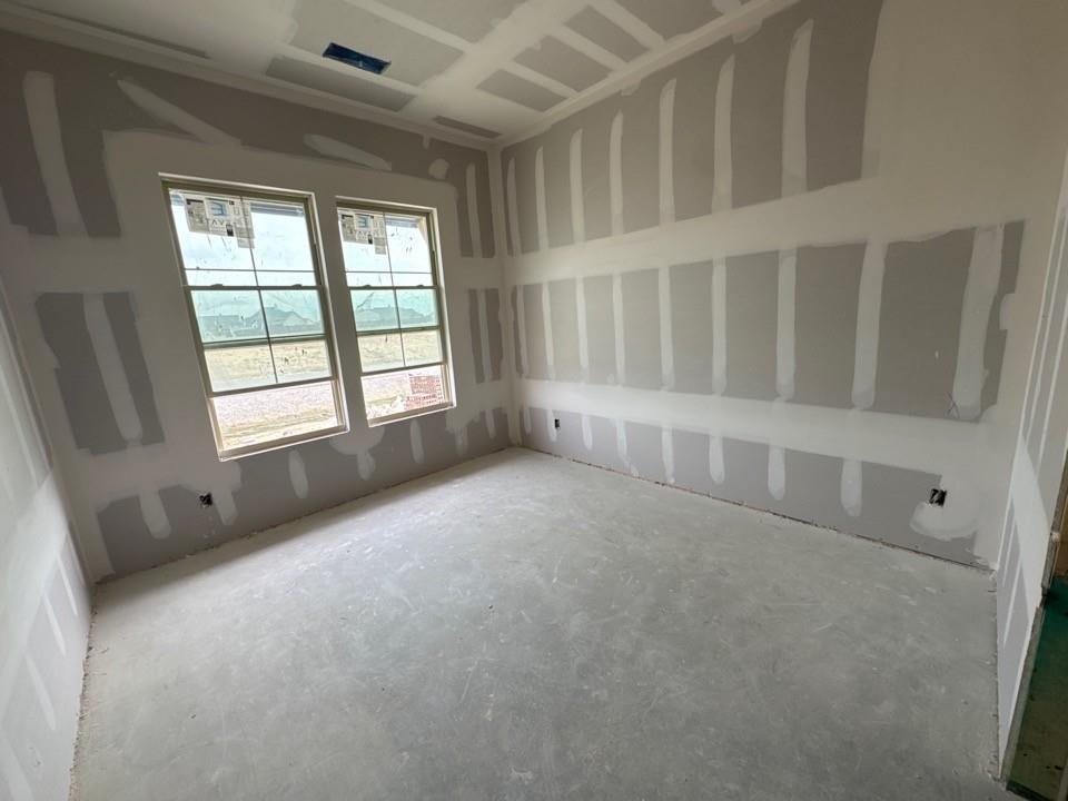 197 Brandywine Trail Rhome, TX 76078 - Photo 9 of 14 a view of an empty room with a window