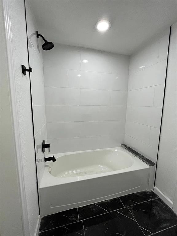 2851 Casey Street Dallas, TX 75215 - Photo 14 of 22 a bathroom with a bathtub