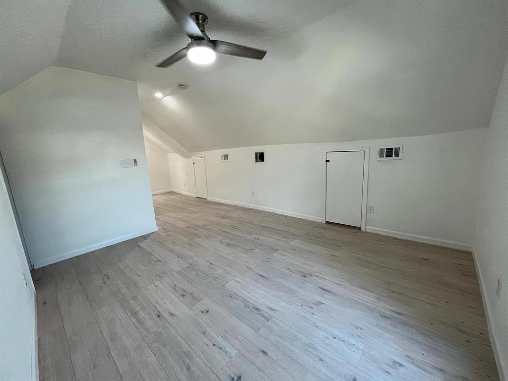 2851 Casey Street Dallas, TX 75215 - Photo 16 of 22 an empty room with wooden floor a ceiling fan and closet