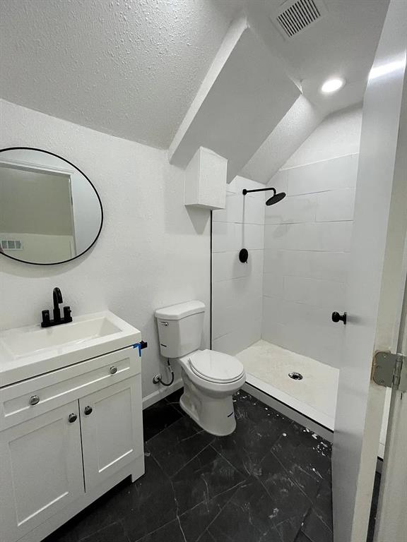 2851 Casey Street Dallas, TX 75215 - Photo 17 of 22 a bathroom with a sink a toilet and a mirror