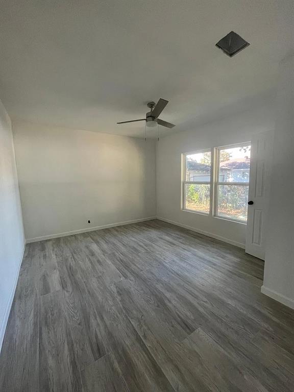 2851 Casey Street Dallas, TX 75215 - Photo 18 of 22 wooden floor in an empty room with a window