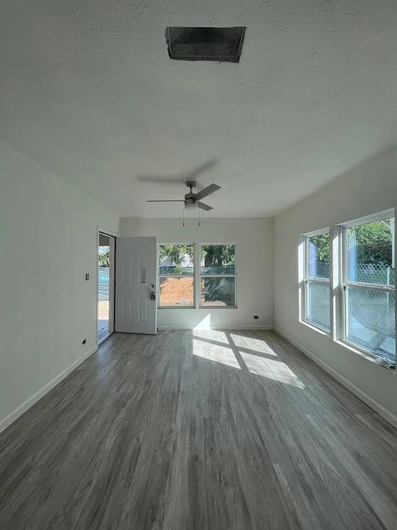 2851 Casey Street Dallas, TX 75215 - Photo 19 of 22 an empty room with wooden floor and windows