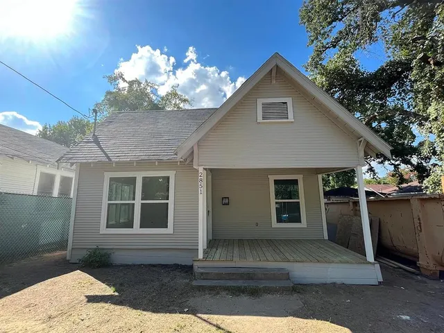 a front view of a house with a garage
