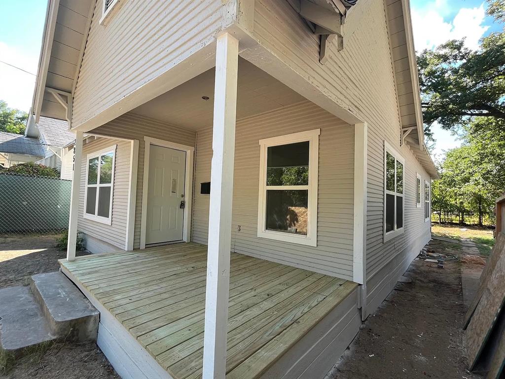 2851 Casey Street Dallas, TX 75215 - Photo 5 of 22 a view of a house with a wooden deck