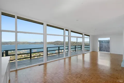 wooden floor with windows and city view