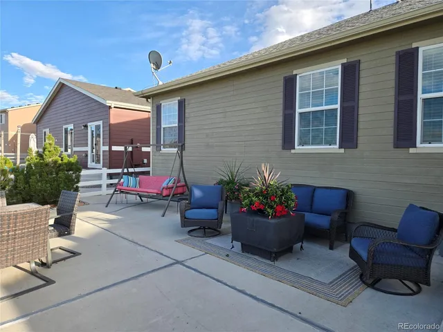 a backyard of a house with seating space