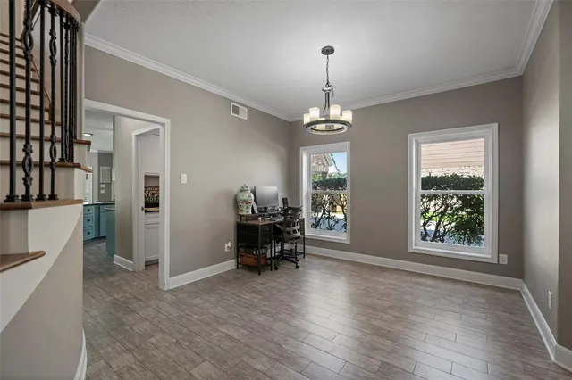 a view of a room with furniture window and wooden floor