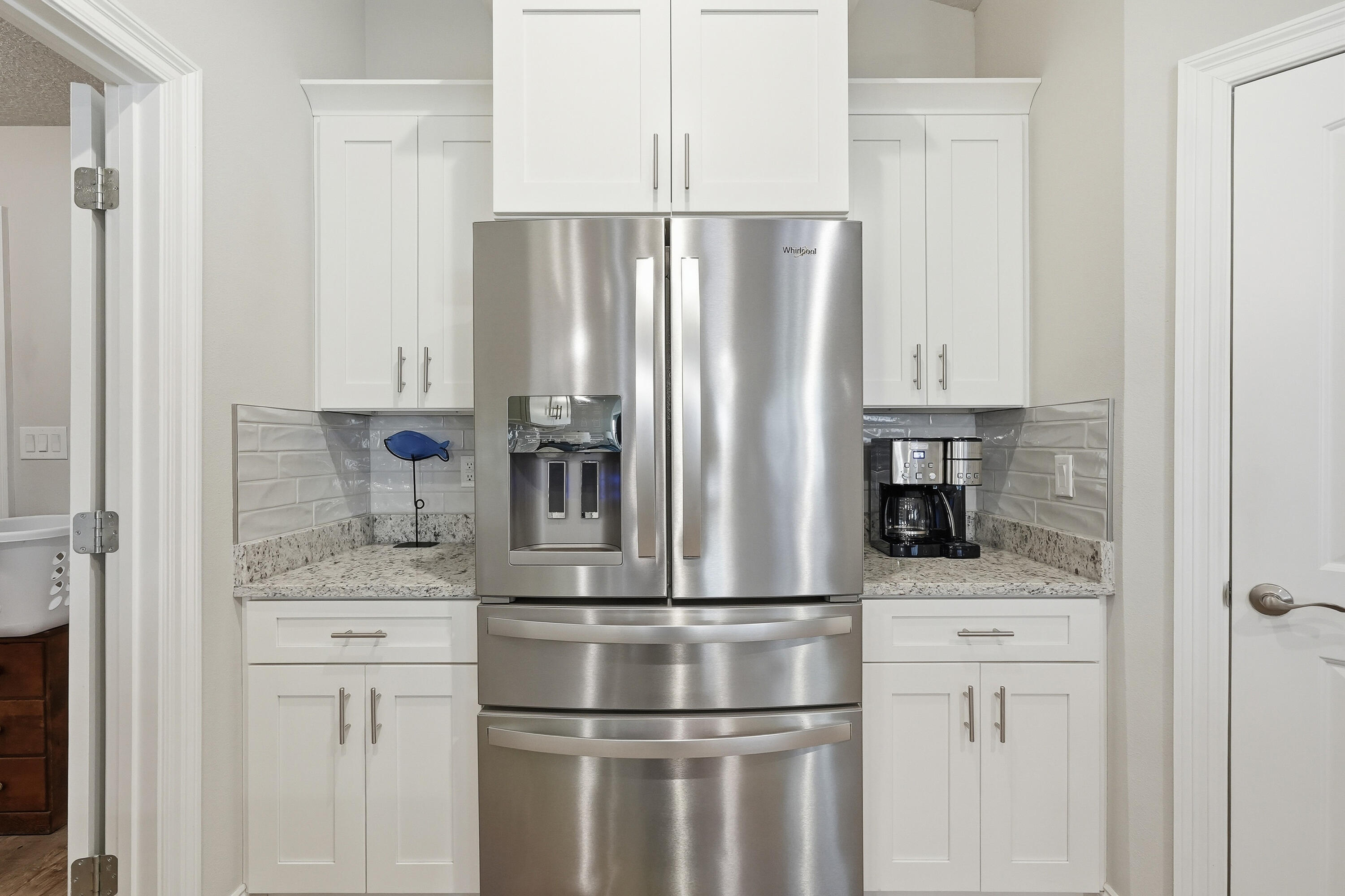 7434 Gordon Evans Road Navarre, FL 32566 - Photo 19 of 51 a metallic refrigerator freezer sitting in a kitchen