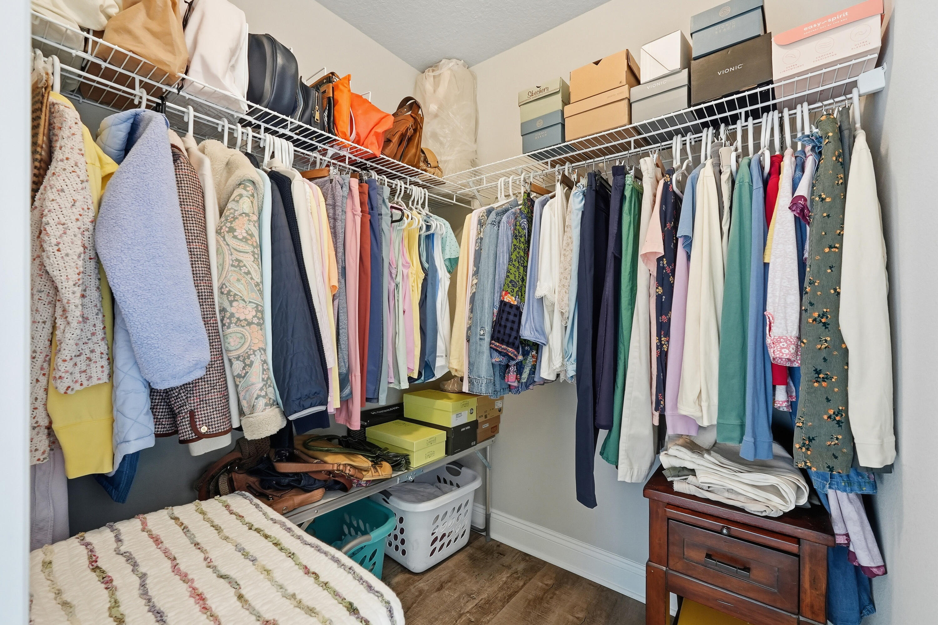 7434 Gordon Evans Road Navarre, FL 32566 - Photo 31 of 51 a view of walk in closet with clothes and shoes