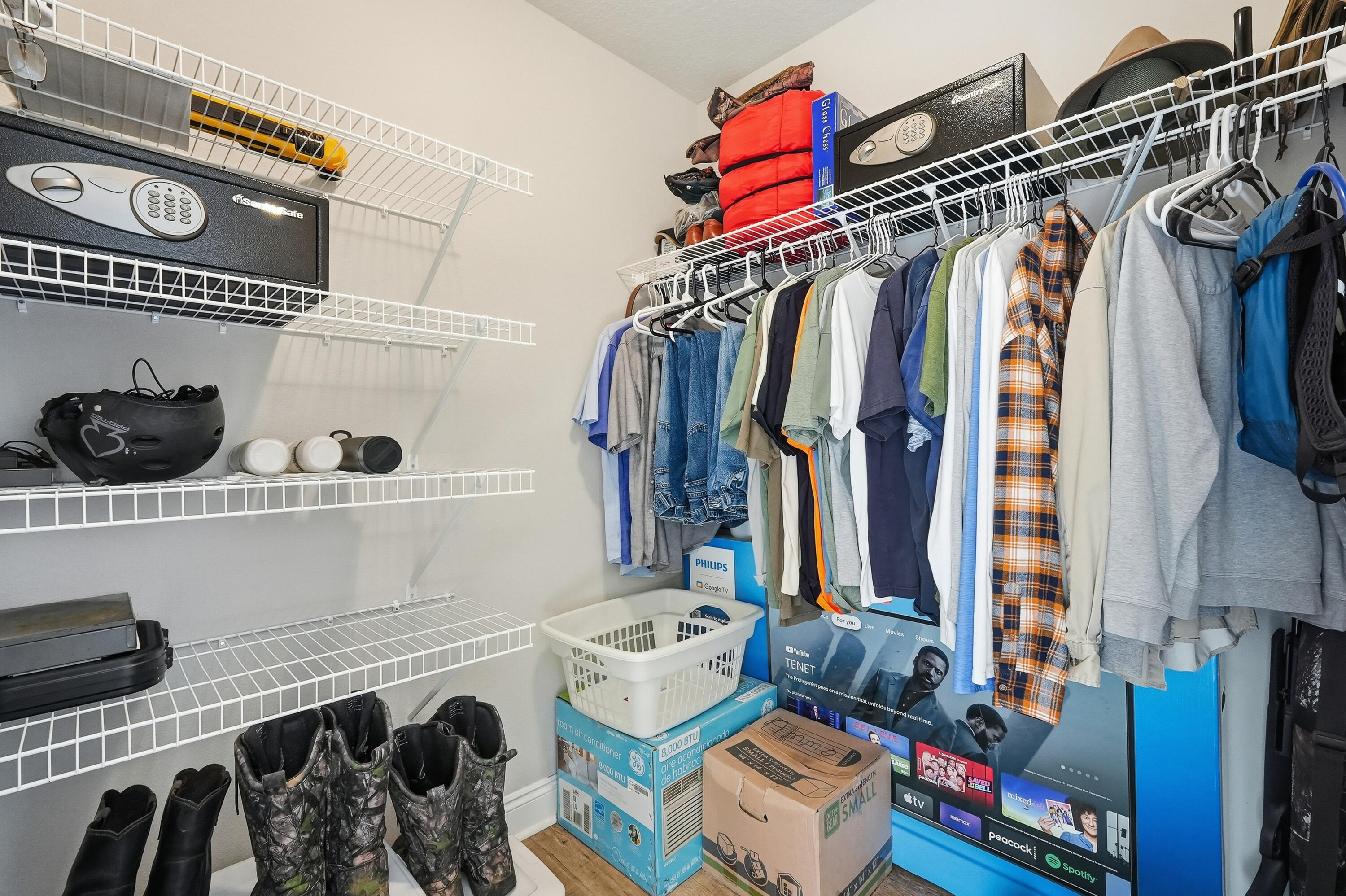 7434 Gordon Evans Road Navarre, FL 32566 - Photo 32 of 51 a view of walk in closet with clothes and shoes