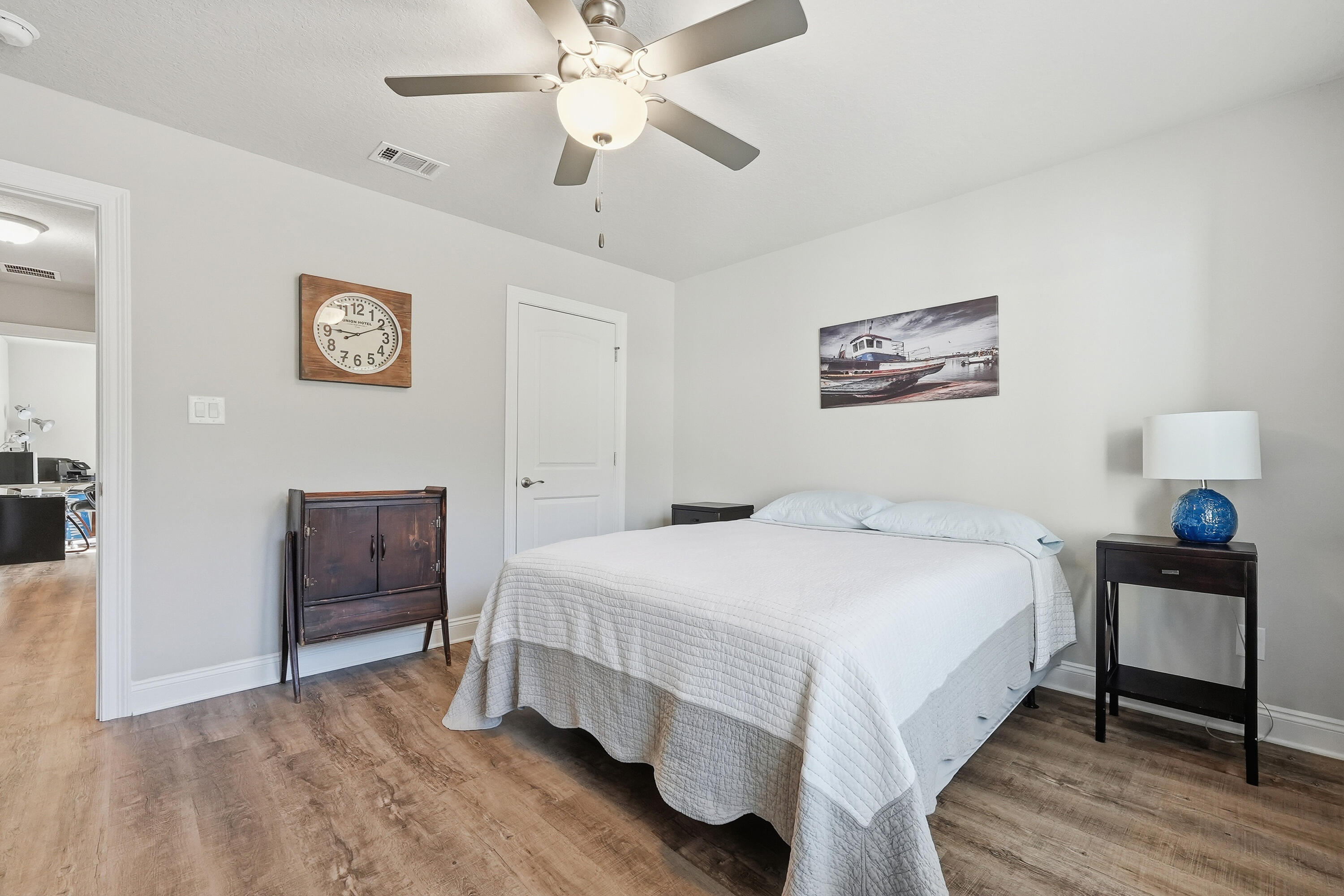 7434 Gordon Evans Road Navarre, FL 32566 - Photo 34 of 51 a bedroom with a bed and a chandelier