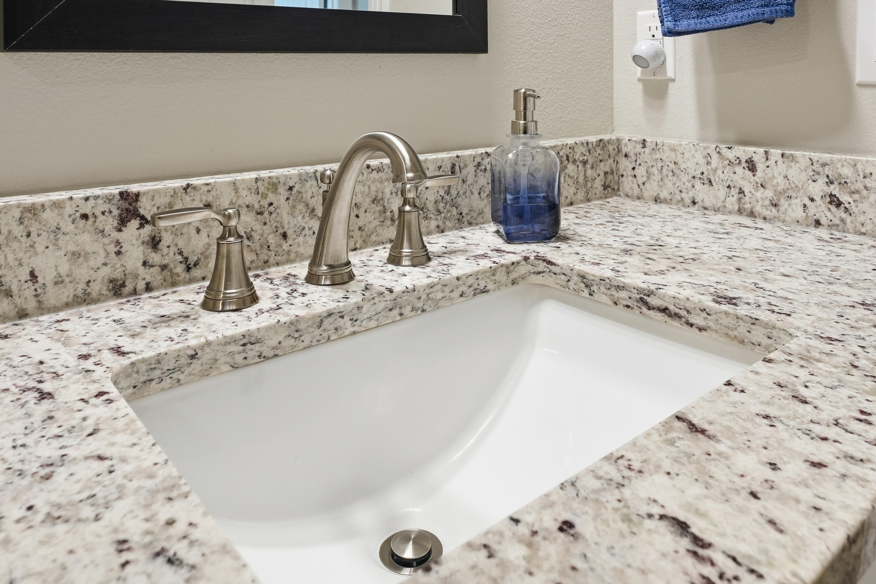 7434 Gordon Evans Road Navarre, FL 32566 - Photo 37 of 51 a bathroom with a granite countertop sink and a mirror