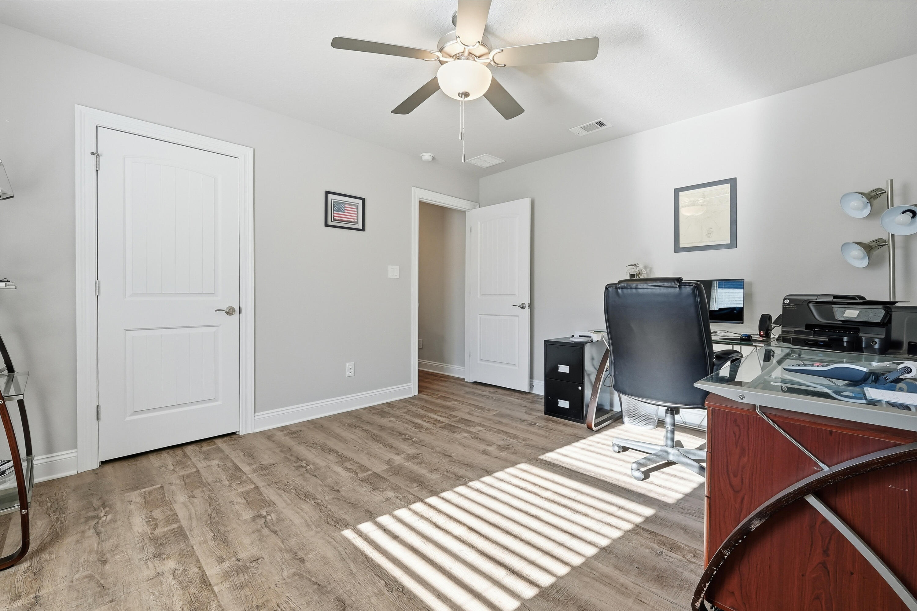 7434 Gordon Evans Road Navarre, FL 32566 - Photo 40 of 51 a workspace with furniture and wooden floor
