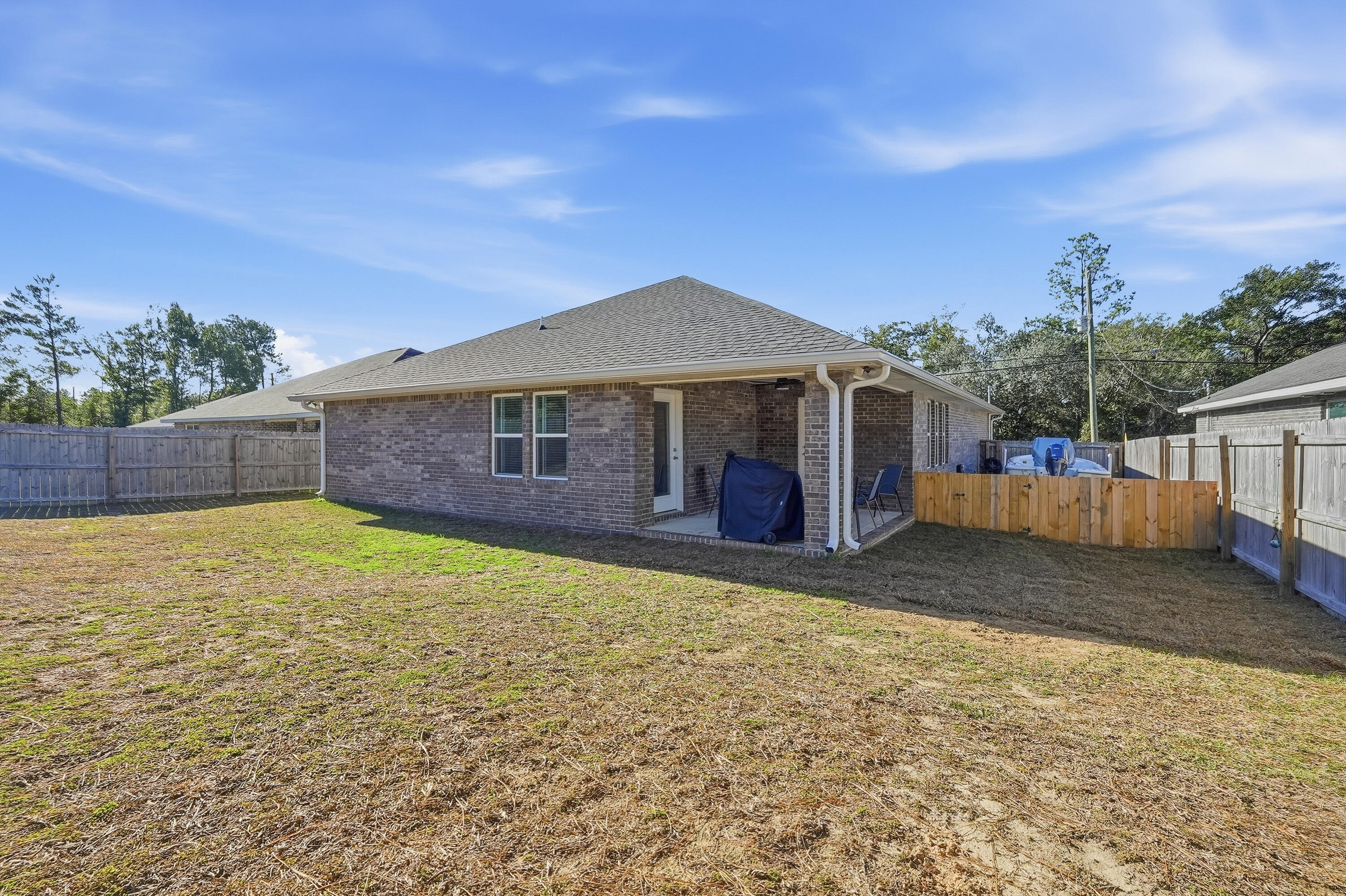 7434 Gordon Evans Road Navarre, FL 32566 - Photo 44 of 51 a front view of a house with garden