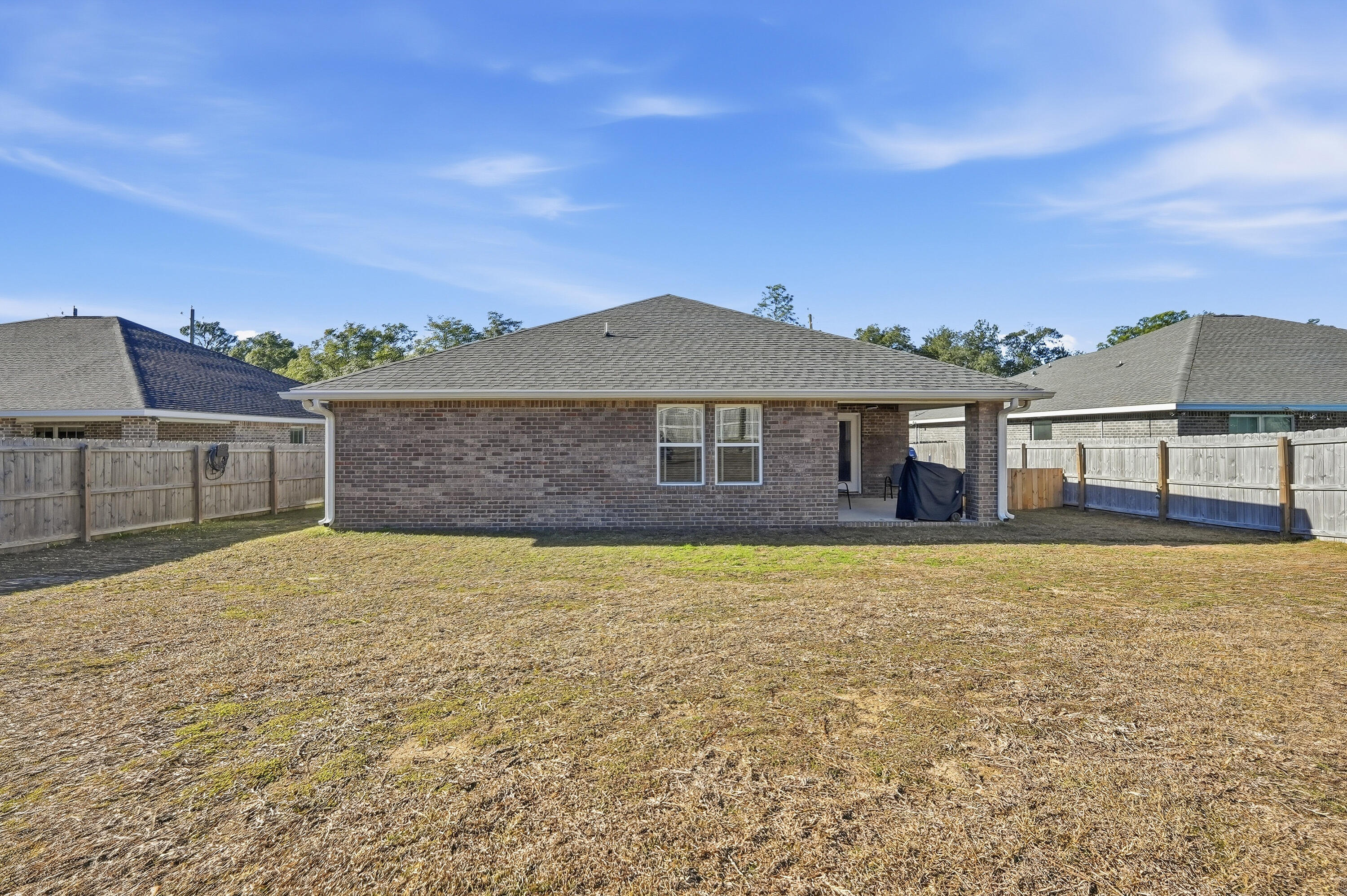 7434 Gordon Evans Road Navarre, FL 32566 - Photo 45 of 51 a front view of a house with a yard