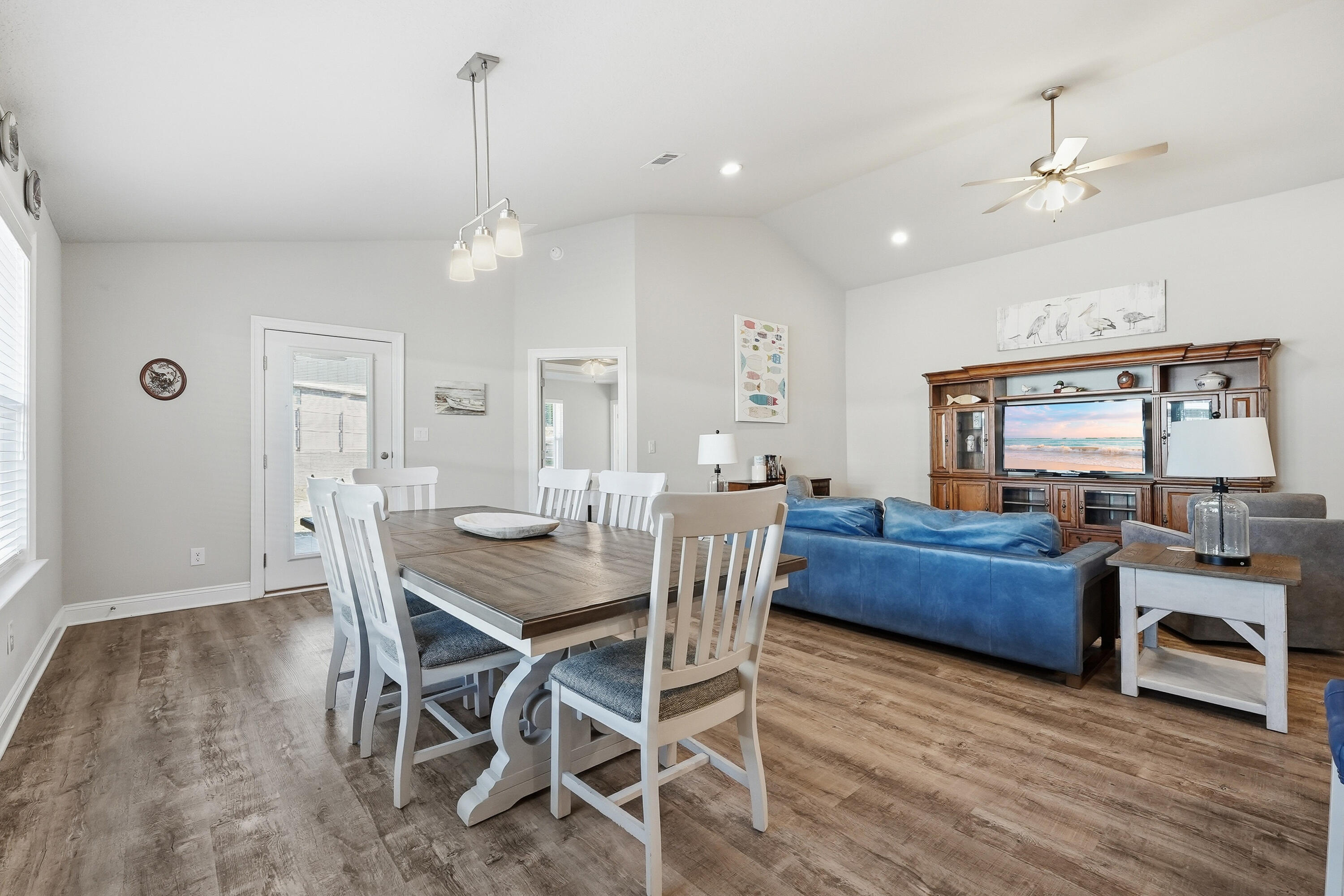 7434 Gordon Evans Road Navarre, FL 32566 - Photo 8 of 51 a view of a dining room with furniture window and wooden floor