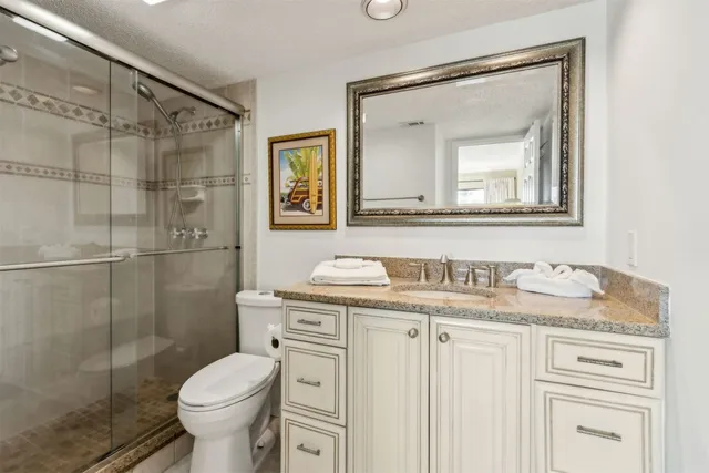a view of a hallway with wooden floor and closet