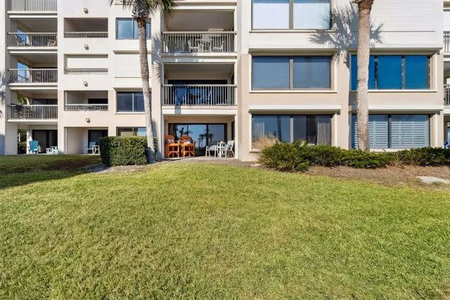 a view of a swimming pool and a back yard