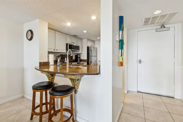 a kitchen with stainless steel appliances granite countertop a sink and cabinets