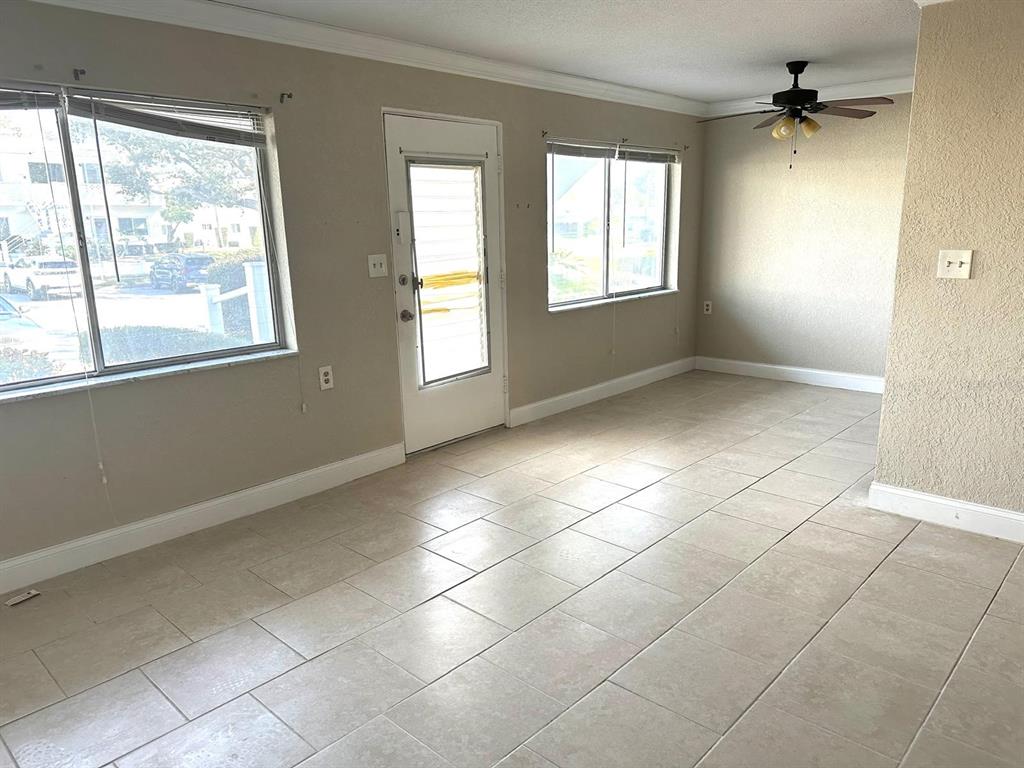 8450 112th Street North, Unit 102 Seminole, FL 33772 - Photo 17 of 80 a view of an empty room with a window