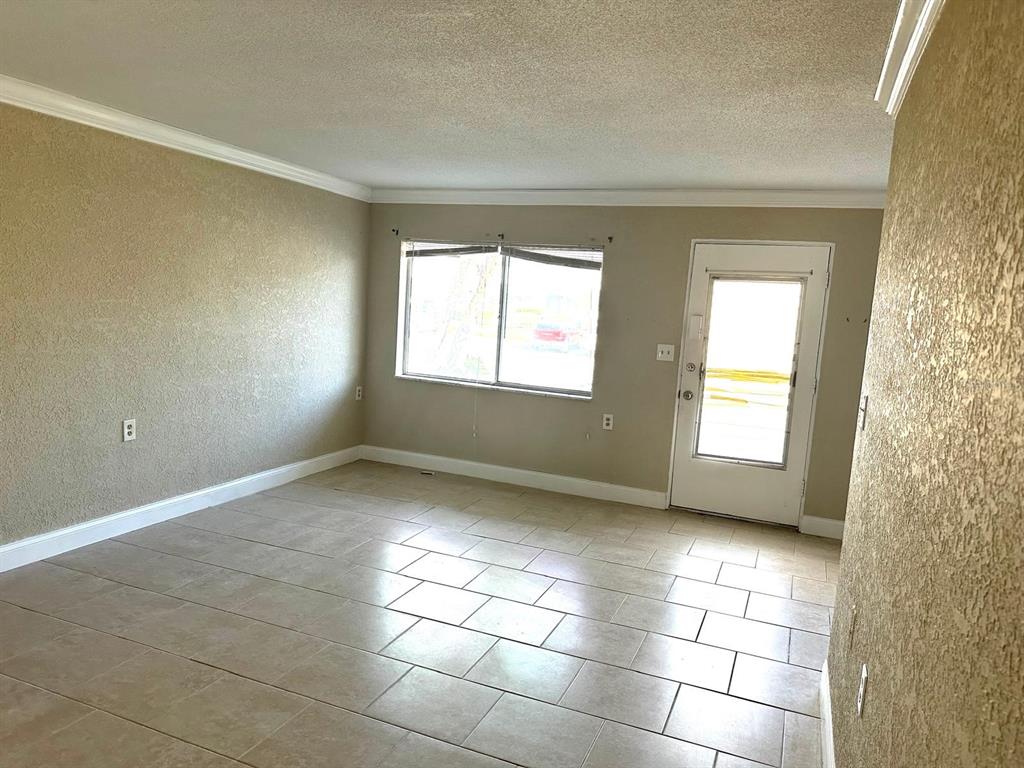 8450 112th Street North, Unit 102 Seminole, FL 33772 - Photo 18 of 80 a view of an empty room and window