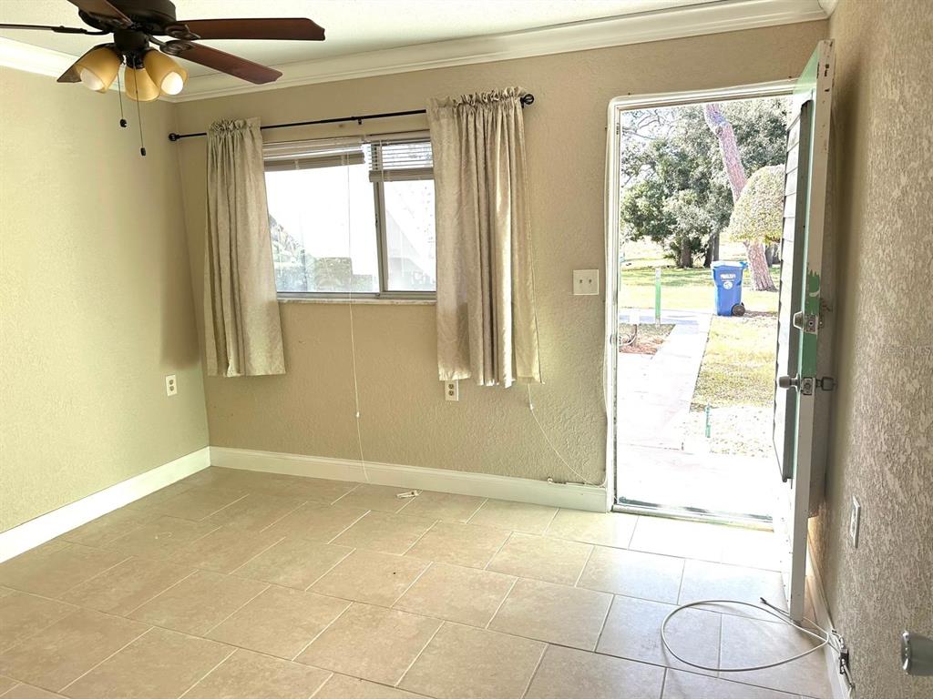 8450 112th Street North, Unit 102 Seminole, FL 33772 - Photo 21 of 80 a view of a livingroom with wooden floor and a window