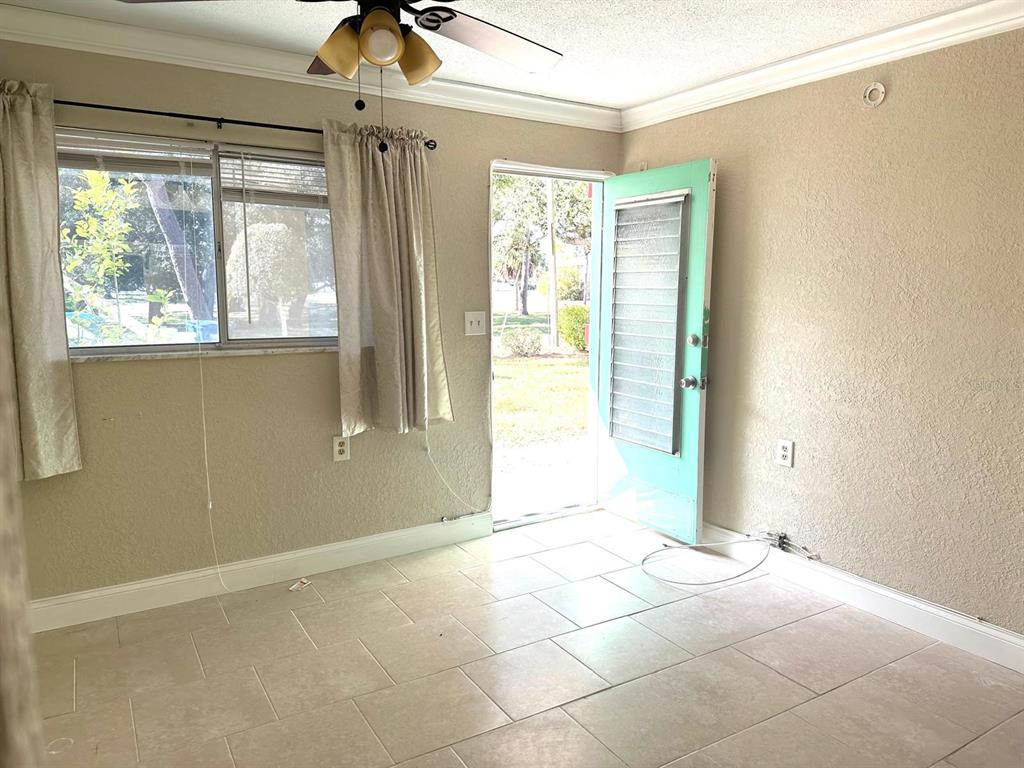 8450 112th Street North, Unit 102 Seminole, FL 33772 - Photo 35 of 80 a view of an empty room with a window