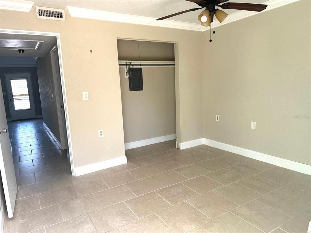 8450 112th Street North, Unit 102 Seminole, FL 33772 - Photo 38 of 80 a view of an empty room with a window