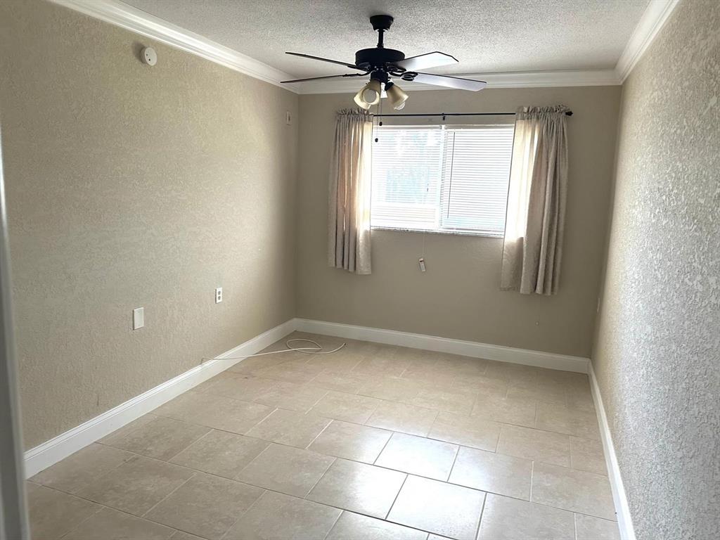 8450 112th Street North, Unit 102 Seminole, FL 33772 - Photo 42 of 80 a view of an empty room with a window