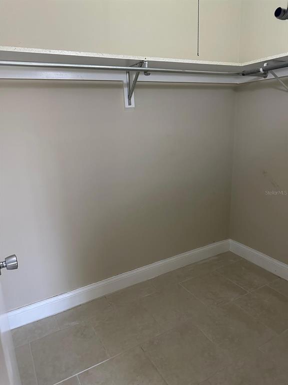 8450 112th Street North, Unit 102 Seminole, FL 33772 - Photo 44 of 80 a view of a room with rack on the wall