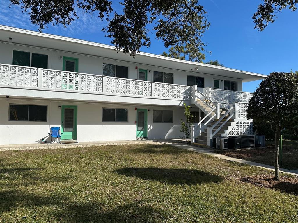 8450 112th Street North, Unit 102 Seminole, FL 33772 - Photo 45 of 80 a front view of a house with garden