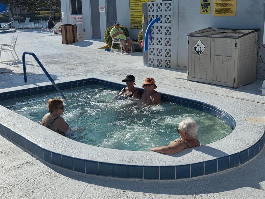 8450 112th Street North, Unit 102 Seminole, FL 33772 - Photo 56 of 80 a living room with furniture and a fireplace
