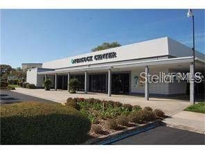8450 112th Street North, Unit 102 Seminole, FL 33772 - Photo 61 of 80 a front view of a building with garden