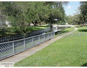8450 112th Street North, Unit 102 Seminole, FL 33772 - Photo 66 of 80 a view of an outdoor space with a garden
