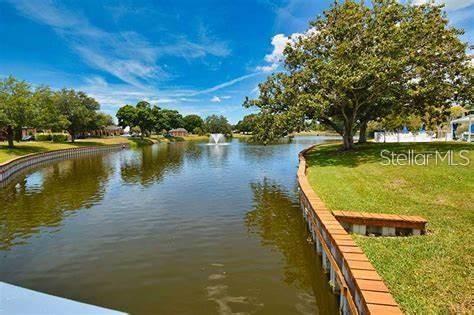 8450 112th Street North, Unit 102 Seminole, FL 33772 - Photo 73 of 80 a view of a lake with a outdoor space