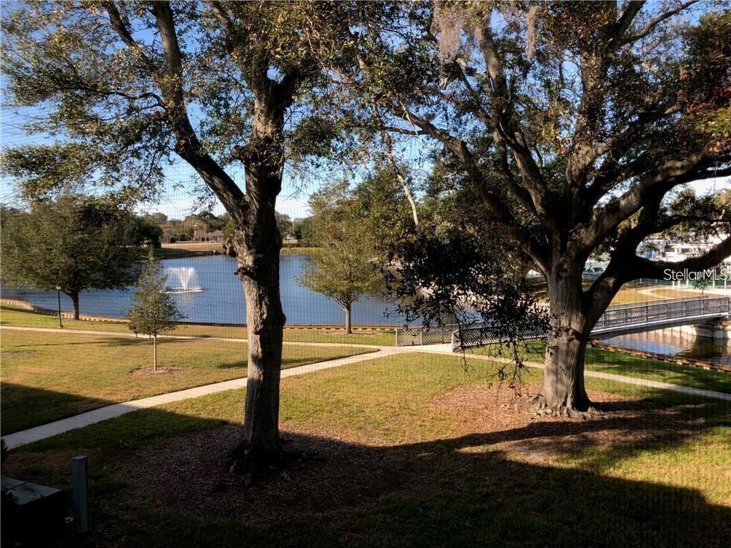 8450 112th Street North, Unit 102 Seminole, FL 33772 - Photo 74 of 80 a view of a swimming pool with an ocean view