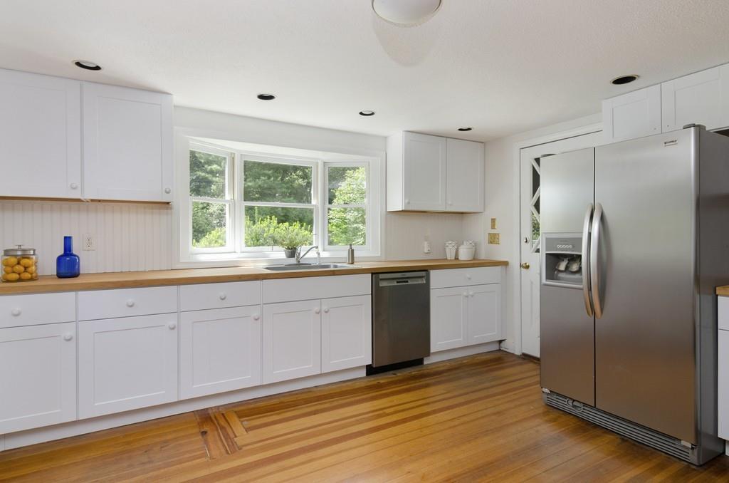 34 Stowe Road Sandwich, MA 02563 - Photo 4 of 19 a kitchen with granite countertop a refrigerator sink and cabinets