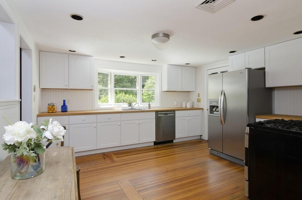 34 Stowe Road Sandwich, MA 02563 - Photo 5 of 19 a kitchen with granite countertop a refrigerator and a sink