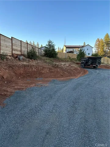 a view of street with parked cars