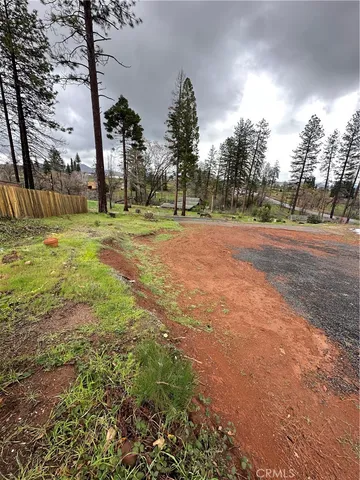 a view of a lake with houses in the back